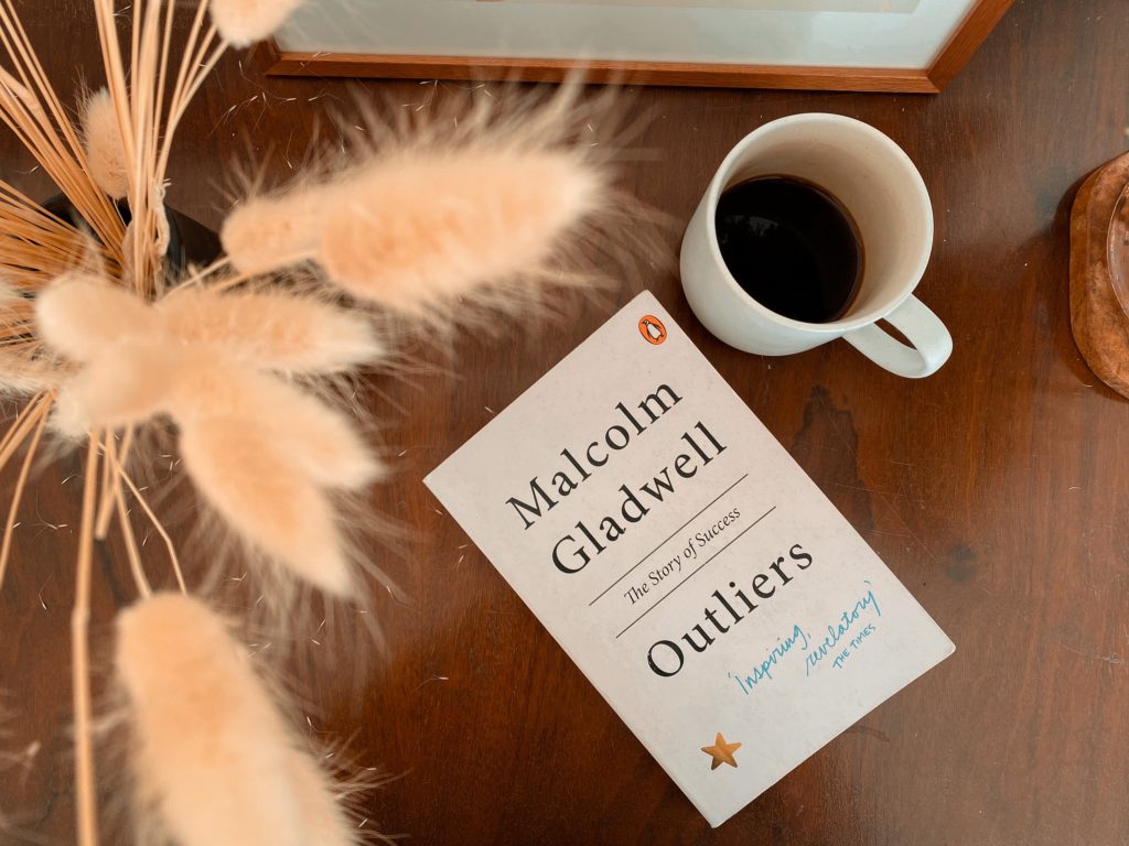 book review on outliers